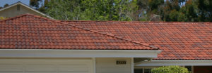 a rust colored tile roof on a one story home